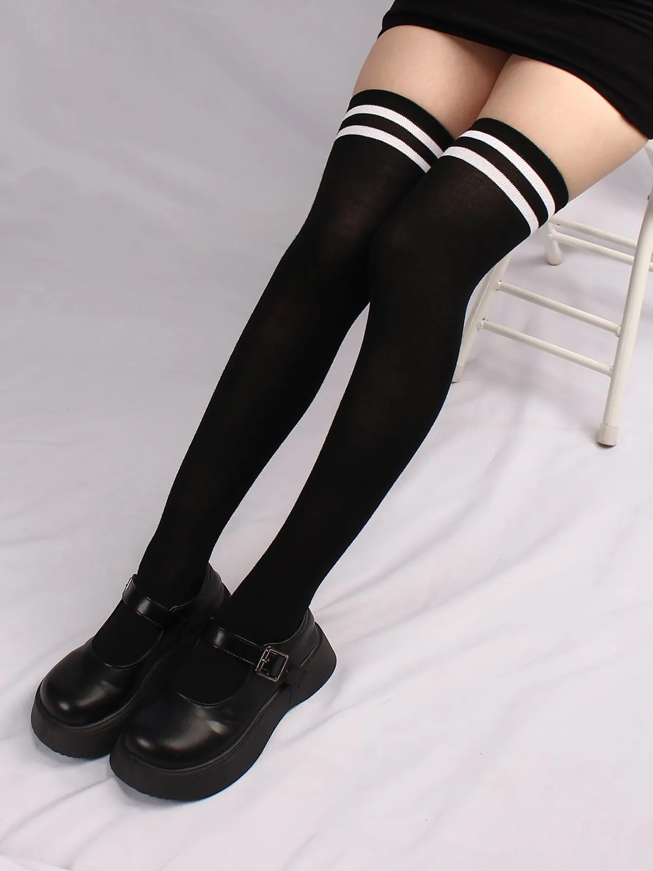 pair of women's black and white horizontal striped knee socks for spring and autumn