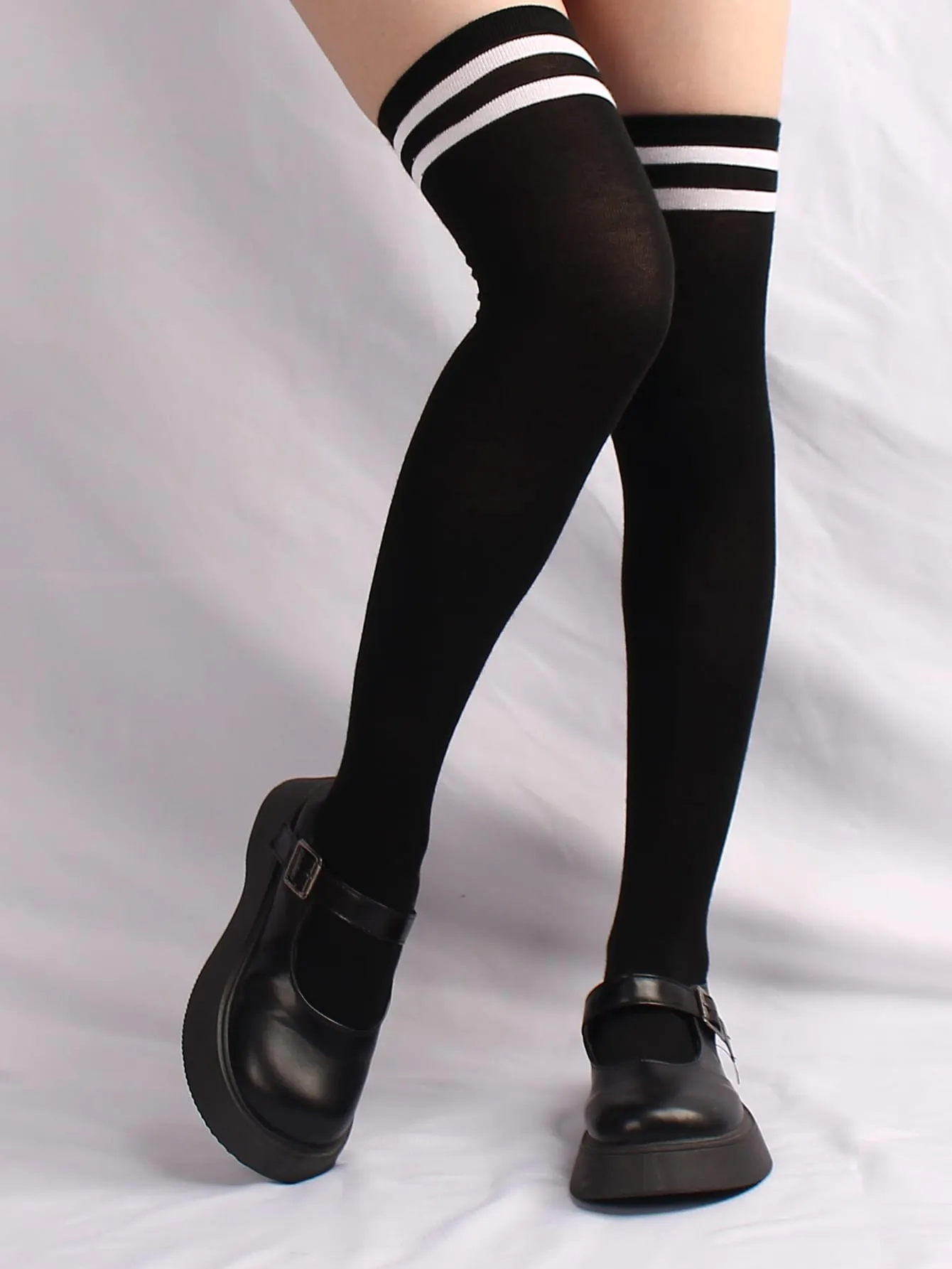 pair of women's black and white horizontal striped knee socks for spring and autumn
