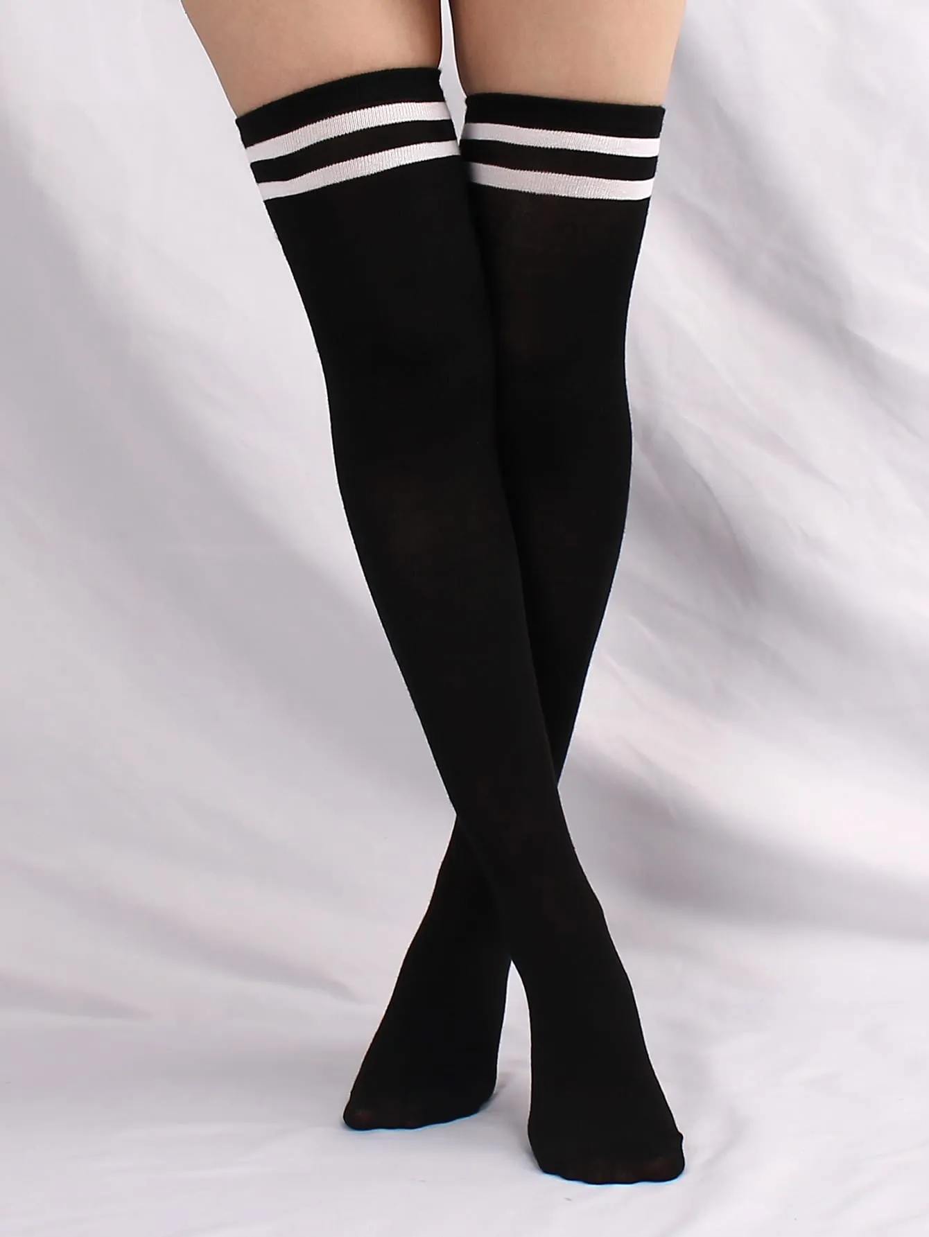 pair of women's black and white horizontal striped knee socks for spring and autumn