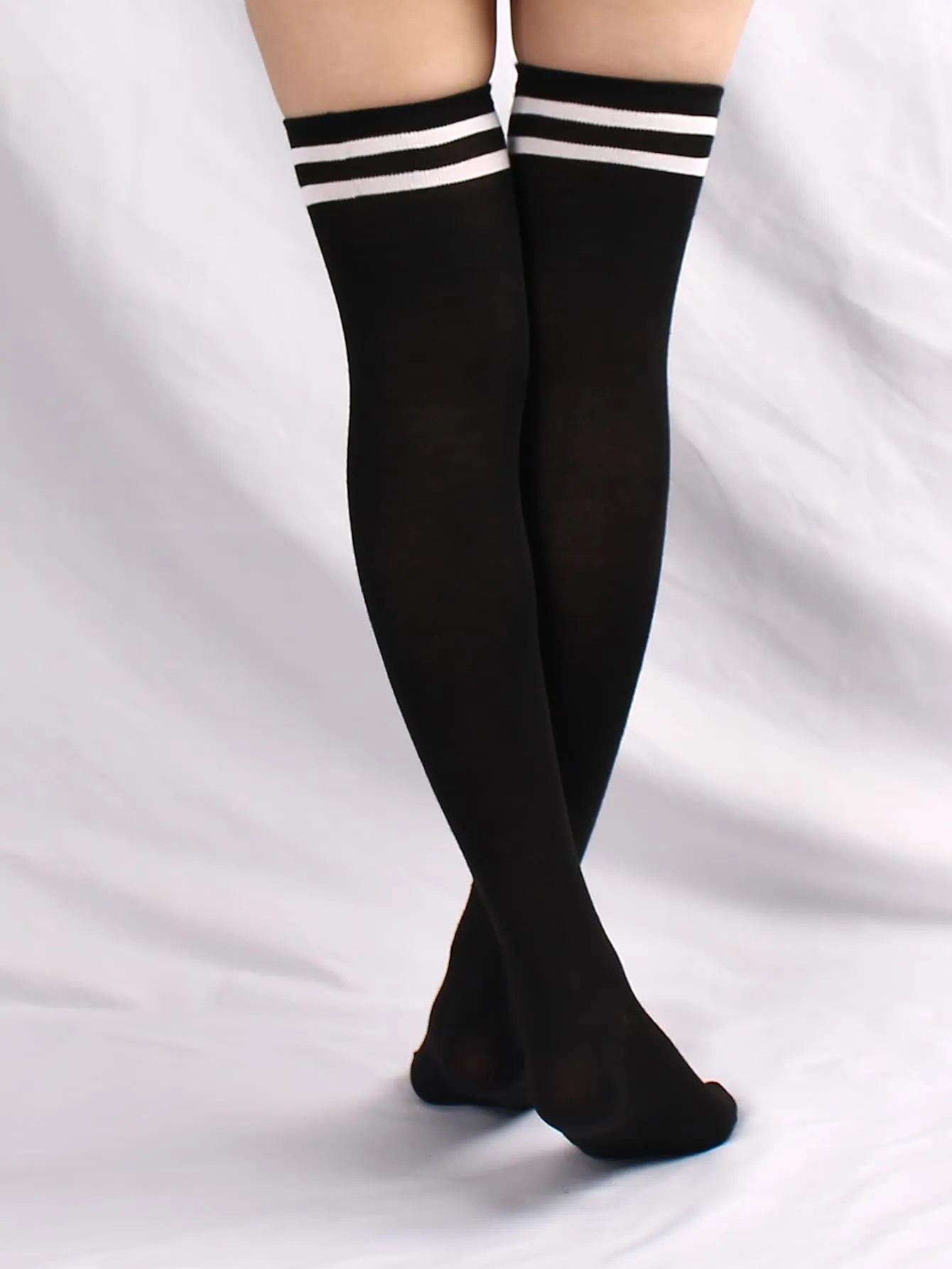 pair of women's black and white horizontal striped knee socks for spring and autumn